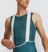Back view of cyclist in Evergreen Air Base Layer, emphasizing durable binding at neckline and armholes