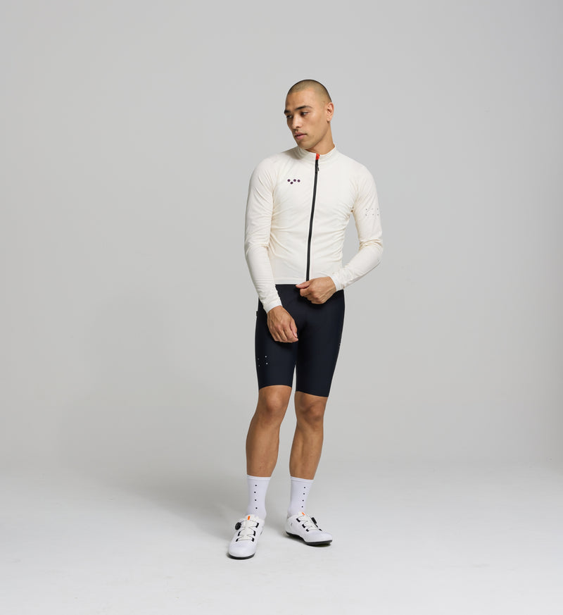 Front view of male cyclist in almond Classic Jacket – sleek fit with SAB two-way zipper, wind-blocking front panels, and stretch design ideal for cool and wet rides.