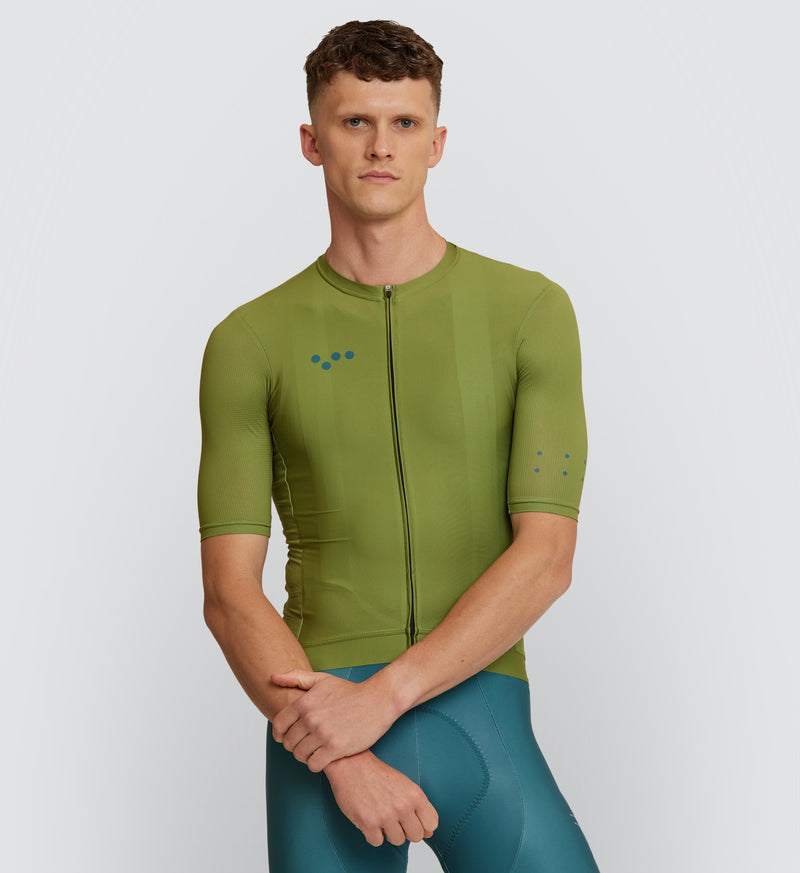 Front view of male cyclist in Moss Classic Cycling Jersey, highlighting breathable fabric and secure silicone hem
