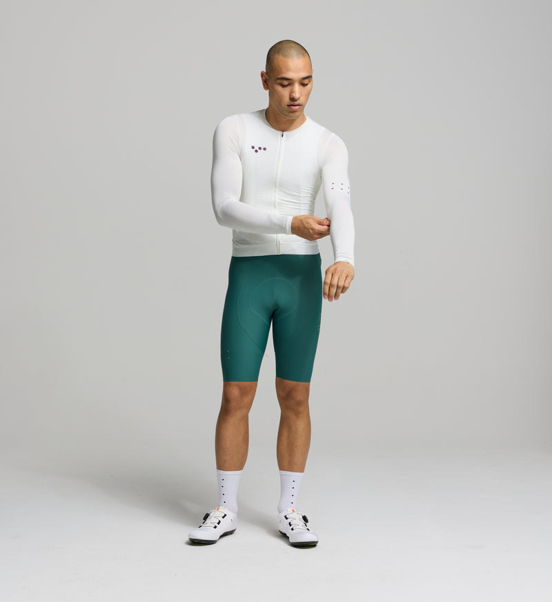 Front view of male cyclist in porcelain Air Long Sleeve Jersey – aerodynamic cut with mesh panels across the chest and sleeves for ventilation during hot weather efforts.