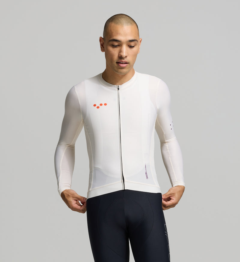 Front view of male cyclist in almond Classic Long Sleeve Jersey – sleek, close fit with extended sleeves and a low-profile collar for all-day riding performance.