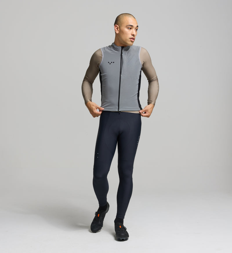 Cyclist wearing RideFLASH Gilet front-facing; reflective shell enhances daytime and nighttime visibility.