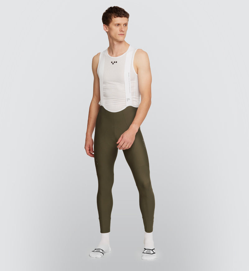 Olive Essentials Men's SuperFit 2.0 Cycling Bib Tight on male model from front, featuring premium Italian fabric for superior muscle support and aerodynamic efficiency.