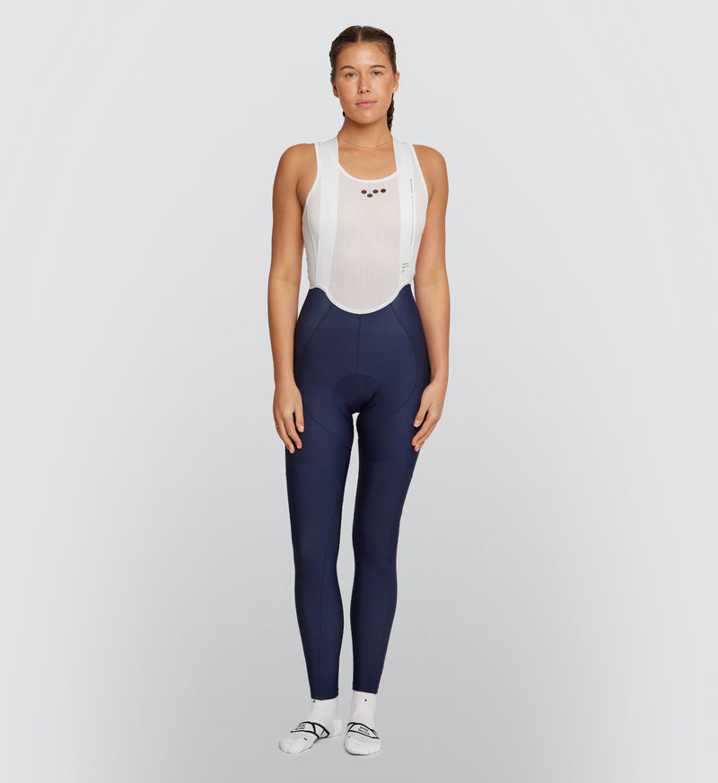 Essentials Women's SuperFLEECE 2.0 Bib Tights - Navy in position 2, best fit day pad for comfort on cold bike rides, padded, straps and full length.