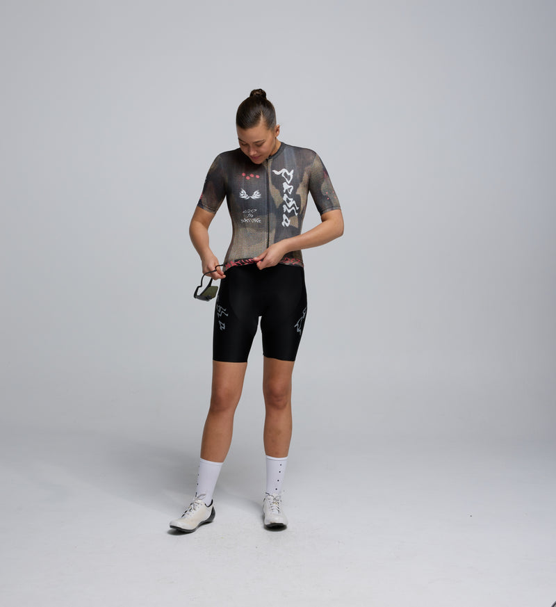 Female cyclist wearing Pedla Training Jersey in Dusty – showcasing tailored fit, extended sleeves, and breathable front panels for year-round riding comfort