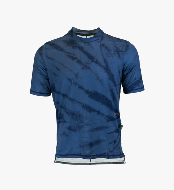 Indigo Tie Dye Off Grid Gravel Tech Tee displayed solo, highlighting its Italian lightweight technical knit and relaxed fit for advanced cycling breathability.
