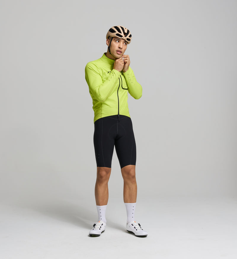 Cyclist wearing the waterproof & windproof Pro Deflect 2.0 Jacket with a high collar for extra protection.