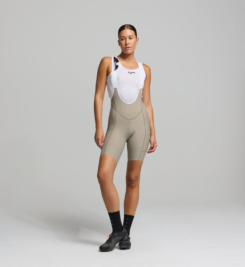 Front view of female cyclist wearing pumice bib shorts – supportive fit with high-density chamois for long-distance comfort