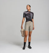 Front view of female cyclist wearing dark purple SuperSYSTEM jersey – breathable woven fabric with bonded hem and aero fit