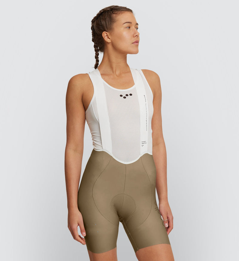Women's SuperFIT 2.0 Cycling Bib Shorts designed for performance, showcasing a seamless cuff, aerodynamic design, and reflective detailing.
