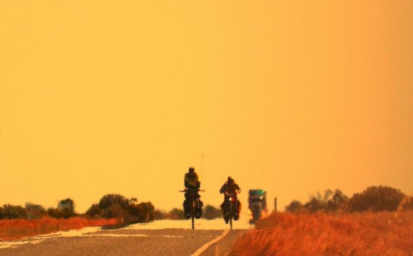 Two Birders, Two Bikes, One School