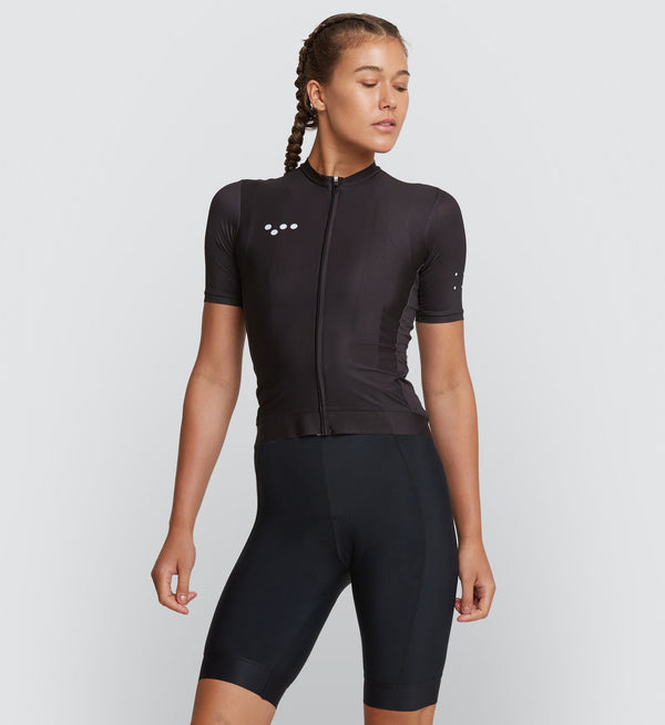 Core Women's Classic Cycling Jersey - Black, black bib shorts on model, improved fit and feel, breathable SPF 50 fabric