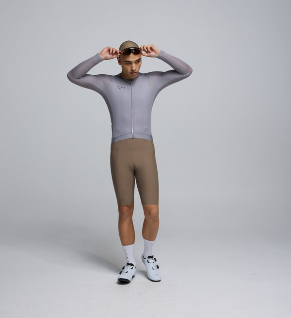 Front view of cyclist wearing Light Grey Air Long Sleeve Jersey – breathable mesh chest and sleeves for airflow and sun coverage