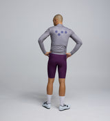 Back view of Classic Cycling Jacket in Light Grey – rear zip pocket doubles as a pack pouch for easy storage on rides