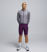 Front view of cyclist wearing Light Grey Classic Jacket – streamlined design with breathable mesh panels and extended coverage