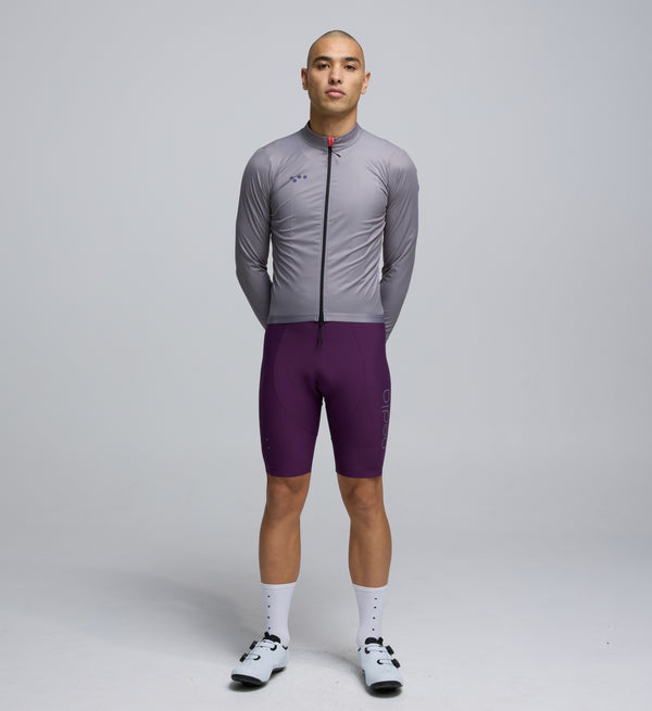 Front view of cyclist wearing Light Grey Classic Jacket – streamlined design with breathable mesh panels and extended coverage
