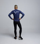 Rear view of cyclist in Dusk Thermal LS Jersey – highlighting three-pocket layout, reflective sleeve detailing, and secure zip pocket