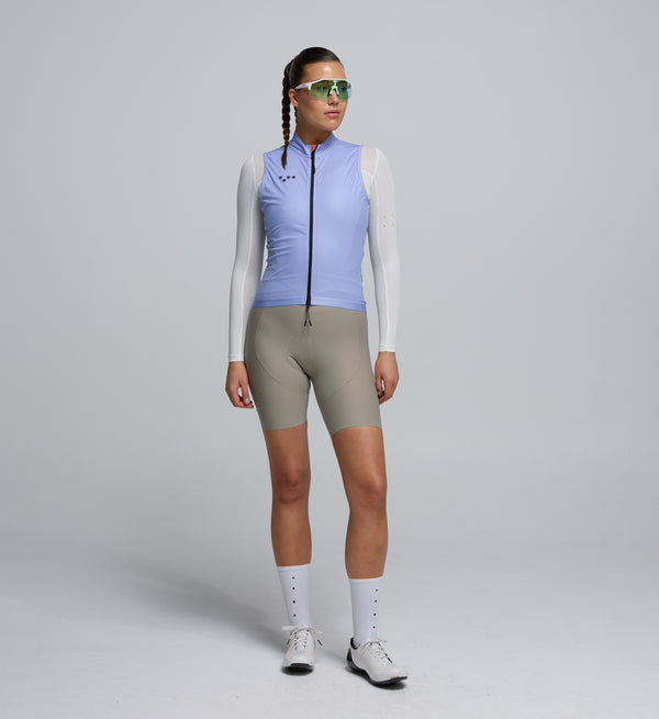 Front view of female cyclist wearing Galactic Lilac Classic LITE Gilet – streamlined fit with reflective details for safety