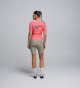 Back view of Women's Classic Cycling Jersey in Coral – featuring rear pockets and silicone hem gripper for a secure cycling fit