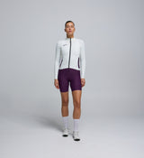 Front view of cyclist in Porcelain Midweight Long Sleeve Jersey – articulated sleeves and clean seam detailing for modern cycling comfort