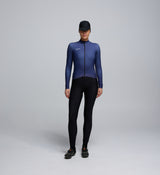 Front view of cyclist wearing Dusk Women's Thermal Long Sleeve Jersey – breathable Chillblock fabric and articulated sleeve design