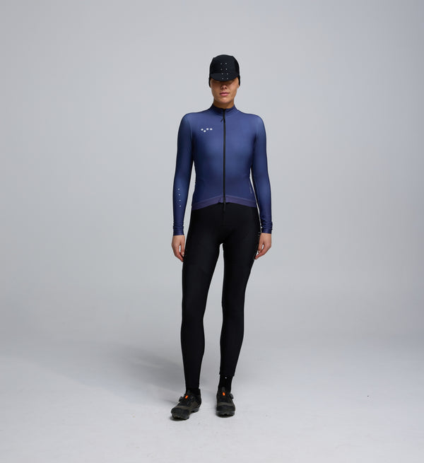 Front view of cyclist wearing Dusk Women's Thermal Long Sleeve Jersey – breathable Chillblock fabric and articulated sleeve design