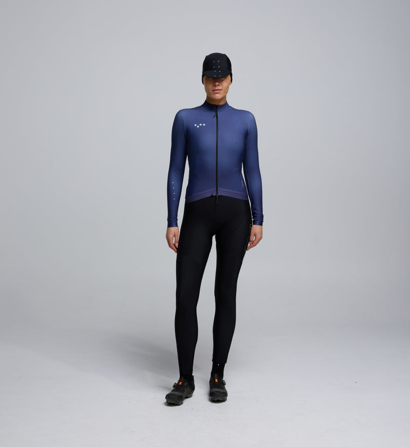 Front view of cyclist wearing Dusk Women's Thermal Long Sleeve Jersey – breathable Chillblock fabric and articulated sleeve design