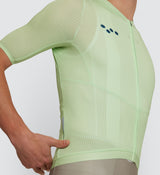 Close-up of Wasabi Air Jersey detailing YKK zipper and stitch-free stretch bonding at the sleeve