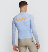 Back view of Men's Sky Air LS Cycling Jersey with minimal back pocket design and reflective safety accents