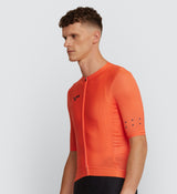 Side view of Men's Classic Cycling Jersey in Tangerine, highlighting side body and underarm ventilation for cooling