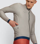 Side view of Men's Stone Thermal Long Sleeve Jersey showing Italian hem gripper and articulated panel design