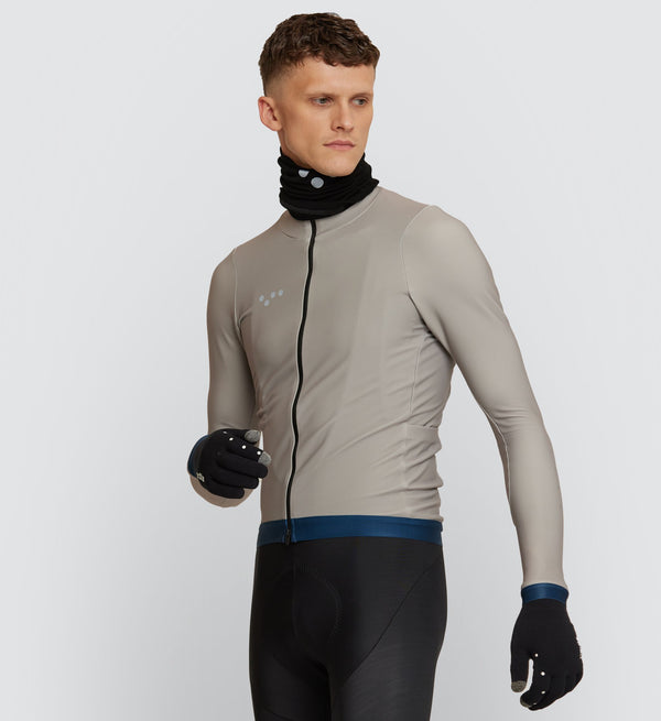 Front view of cyclist wearing Stone Thermal Long Sleeve Jersey, highlighting warmth and movement-optimized design