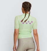 Back view showing Women's Wasabi Air Cycling Jersey's lightweight back pocket and reflective safety accents
