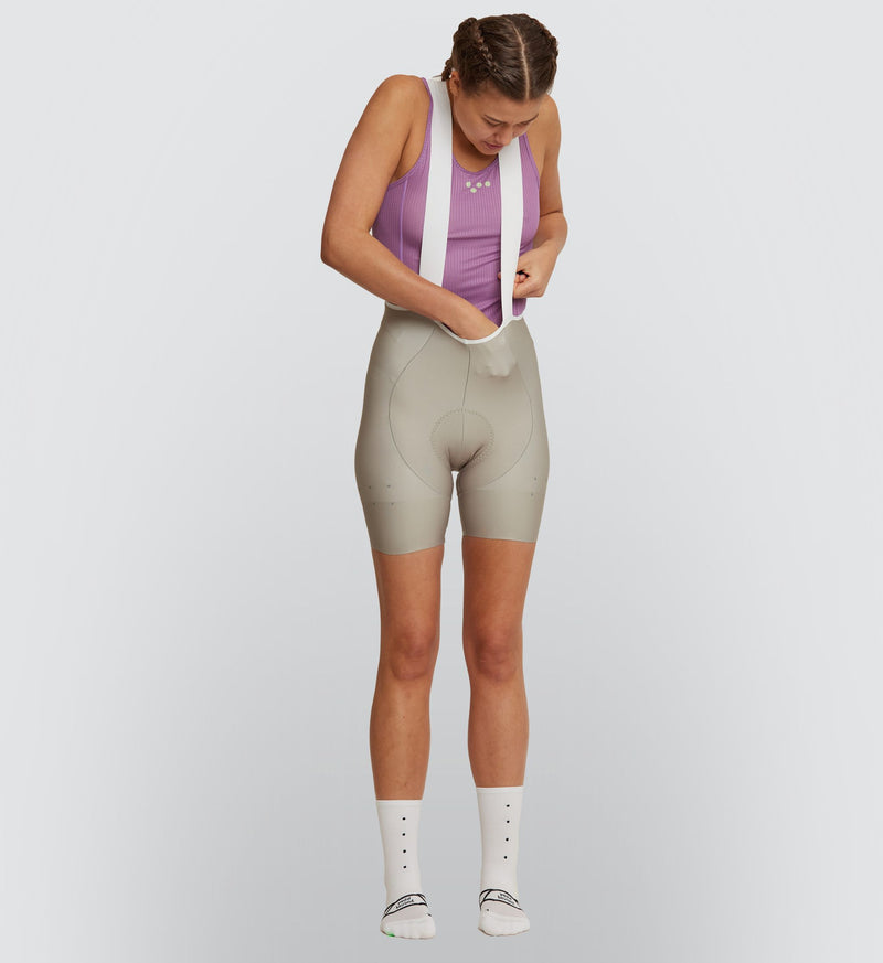 Front view of female cyclist wearing Mauve Air Cycling Base Layer, showcasing racer-back design for superior comfort