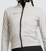 Close-up of the Women's Thermal Cycling Jacket in Chalk, detailing the YKK two-way Vislon® zipper and fabric quality