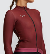 Close-up of the Rust Thermal Long Sleeve Cycling Jersey for Women, detailing the high-quality YKK 2-way Vislon® zipper and fabric durability