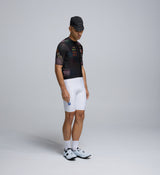 Side profile of Men’s Classic Cycling Jersey - Carbonado, featuring extended sleeve length and ventilated panels.