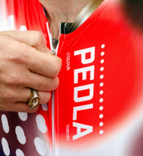 Close-up of the Spectrum White cycling jersey fabric, emphasising four-way stretch material and fine stitching for durability and comfort.