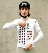 Model wearing the COLOUR THEORY Men's Classic Long Sleeve Cycling Jersey in white, showcasing a form-fitting design, long sleeves, and moisture-wicking fabric for all-day comfort on the road.