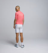 Rear view of Pedla’s Men’s Air Cycling Jersey in Coral showcasing three reinforced rear pockets and sleek fit