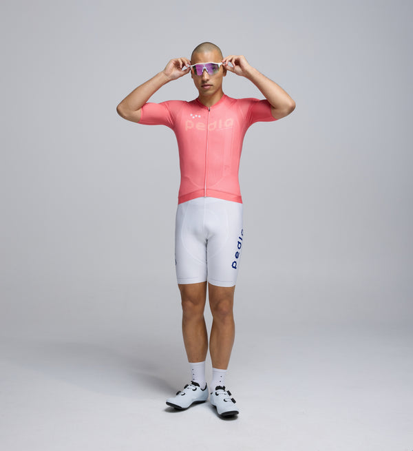 Front view of Pedla’s Men’s Air Jersey in Coral highlighting sleek fit, mesh chest panels, and premium construction