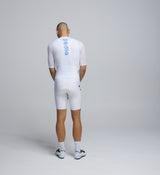 Rear view of Pedla’s Men’s LunaAir Cycling Jersey in White showcasing three rear pockets and silicon-injected hemline band