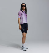 Men's LunaLUXE Classic mauve-fade dot print cycling jersey, side view — performance road jersey with SPF50 breathable moisture-wicking fabric, four-way stretch, ventilation panels, extended sleeves and silicone hem gripper