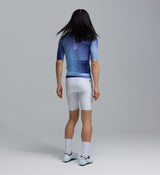 Men's LunaAir navy gradient cycling jersey back view, race-fit moisture-wicking fabric, breathable Signature AIR mesh sleeves, UPF 35+ sun protection, silicon gripper hem and three rear pockets for road, commute and training rides