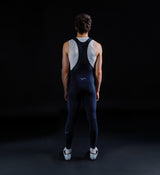 Men's SuperFLEECE 2.0 black thermal cycling bib tights (back view) with lightweight brace system, Italian Roubaix fleece-back fabric, perforated center back, reflective logos and Elastic Interface Carbonium chamois for winter rides