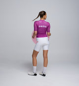Rear view of Pedla’s Women’s Climba Cycling Jersey in Violet showcasing reinforced rear pockets and aerodynamic design