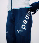 Close-up of black Women's SuperFLEECE 2.0 thermal cycling bib tights with lightweight brace system, Italian Roubaix fleece-back fabric, Elastic Interface Carbonium chamois, perforated rear breathability panel and reflective logos