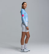 Women's thermal long-sleeve cycling jersey, blue gradient Chillblock fabric with thermal-fleeced interior, pink dot sleeve, reflective logos, UPF 50+, zip side pocket, 3-pocket system for winter rides