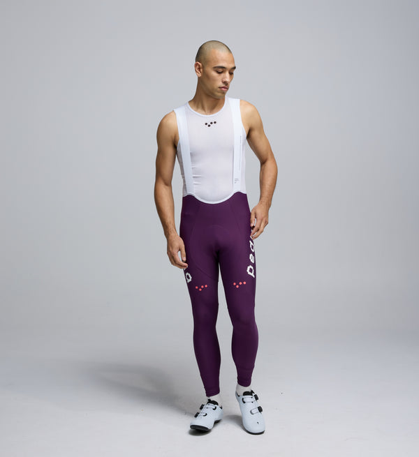 Front view of Pedla’s Men’s SuperFIT 2.0 Bib Tight in Aubergine showcasing sleek aerodynamic fit and high-performance construction