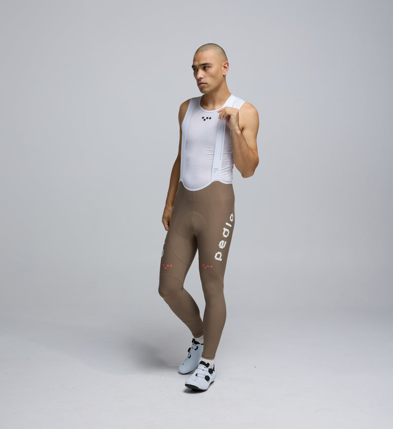 Front view of Pedla’s Men’s SuperFIT 2.0 Bib Tight in Stone showcasing sleek fit and high-performance design